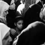 8 June 2018: A Palestinian girl is stuck in the crowd of worshippers passing the Qalandia checkpoint on the last Friday of Ramadan. Photograph: Anne Paq/activestills.org