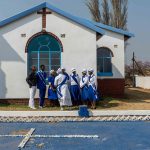 5 August 2018: Lethukuthula Thela is seen with fellow members of the church choir outside the premises of the St John’s Apostolic Church in the township of Wesselton near Ermelo.