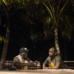 20 September 2018: Abahlali baseMjondolo activist S’bu Zikode (right) in conversation with American activist Willie Baptist (left) at Winneba Beach in Ghana.