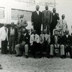 (L-R) Allison Champion and Clements Kadalie (standing, with handwritten names above), along with other ICU members, in this undated photograph from the 1920’s. (Photograph courtesy of UKZN Campbell Collection)