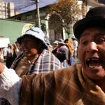 31 May 2005: Women march through the streets of La Paz, Bolivia, to demand the resignation of President Carlos Mesa and force the government to nationalise Bolivia's gas reserves. (Photograph by Spencer Platt/Getty Images)