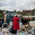 16 January 2019: Mamshi Kau drinks leftover Coca-Cola from a bottle that she found in the course of her recycling work, which helps support five children in Lesotho.