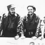 22 August 1960: Ernesto “Che” Guevara, second from right, with Cuban leader Fidel Castro, second from left, reviewing a peasant militia parade at the San Julian Base in Cuba. (Photograph by Bettmann/Contributor)