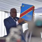 24 January 2019: Félix Tshisekedi holds up the Constitution during his inauguration ceremony as the new president of the Democratic Republic of the Congo, which took place at the Palais de la Nation in Kinshasa. (Photograph by Reuters/Olivia Acland)