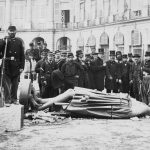 May 1871: The statue of Napoleon I was pulled down along with the Vendome Column on which it stood in a ceremony during the reign of the Paris Commune. Bearded painter Gustave Courbet is ninth from the right. (Photograph by Hulton Archive/Getty Images)