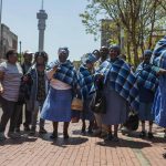 25 October 2018: Residents of the Lesetlheng village community from the North West celebrating outside the Constitutional Court after the court set aside the High Court interdict evicting them from their farming land.