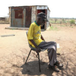 21 October 2013: Joseph Mampye in front of his shack near the Wallmansthal military base where residents were forcibly evicted from in the 1950's. A claim for the land was lodged with the government in 1996. (Photograph by Vathiswa Ruselo/Gallo images)