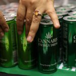 13 December 2018: Expo-goers reach out energy drinks, made from cannabis, on display at the opening of the four-day Cannabis Expo in Pretoria. (Photograph by Siphiwe Sibeko/Reuters)