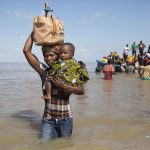 29 March 2019: Dorinda Antonio and her son Manuel Lazalo arrive by boat in Beira from Buzi, one of the areas worst affected by Cyclone Idai.