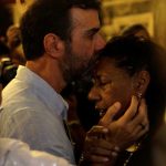 14 March 2019: Marinete da Silva - activist Marielle Franco’s mother - is greeted by congressman Marcelo Freixo during a mass in Rio de Janeiro Brazil to mark the first anniversary of Franco's murder. (Photograph by Reuters/Ricardo Moraes)