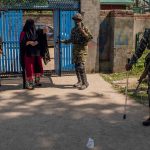 23 April 2019: A Kashmiri woman enters a deserted polling station in Anantnag. Pro-freedom resistance groups in Kashmir asked people to stay away, calling for a complete shutdown of the Indian elections. (Photograph by Yawar Nazir/Getty Images)