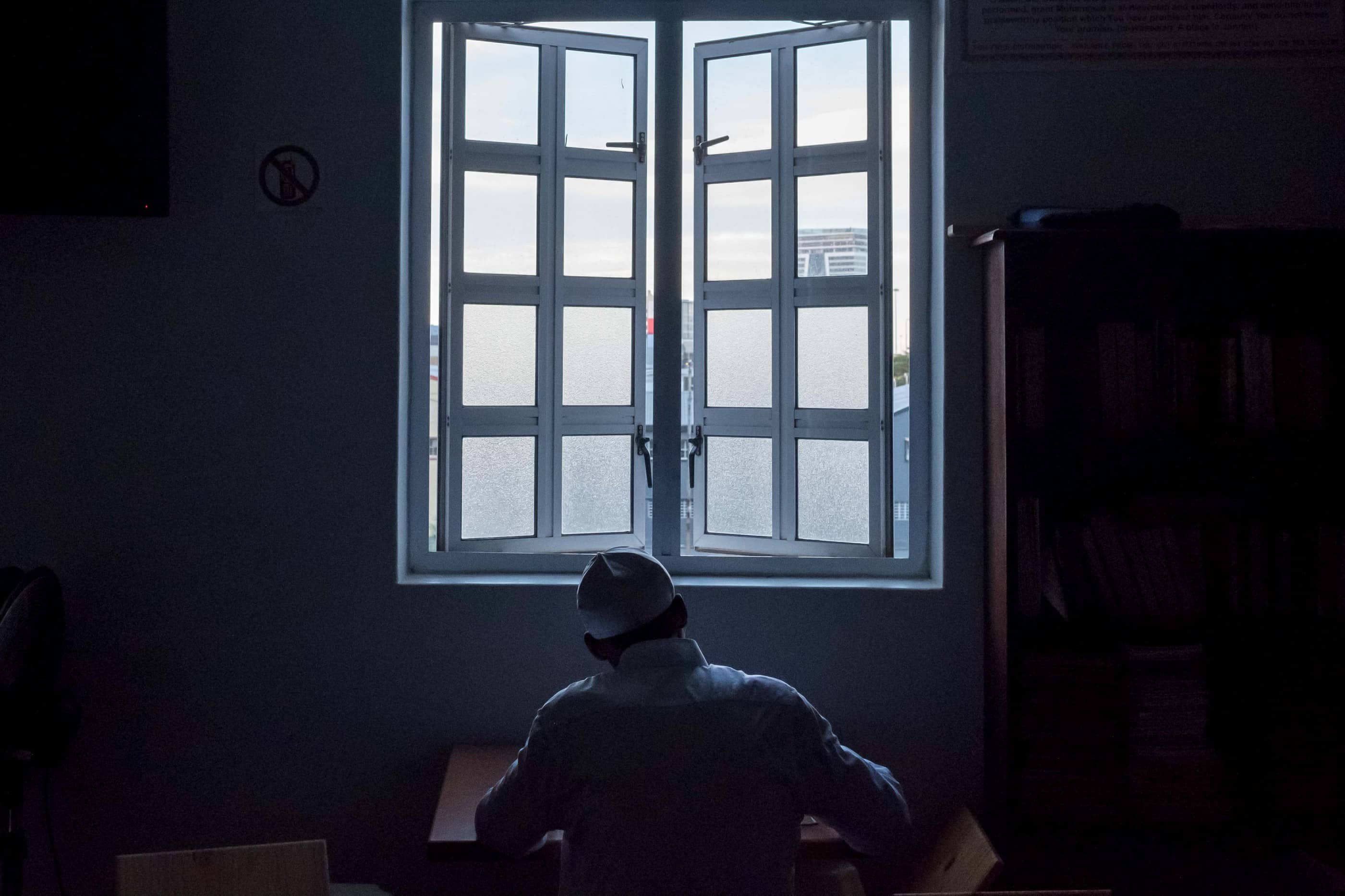 18 May 2019: A man reading the Quran at the mosque.