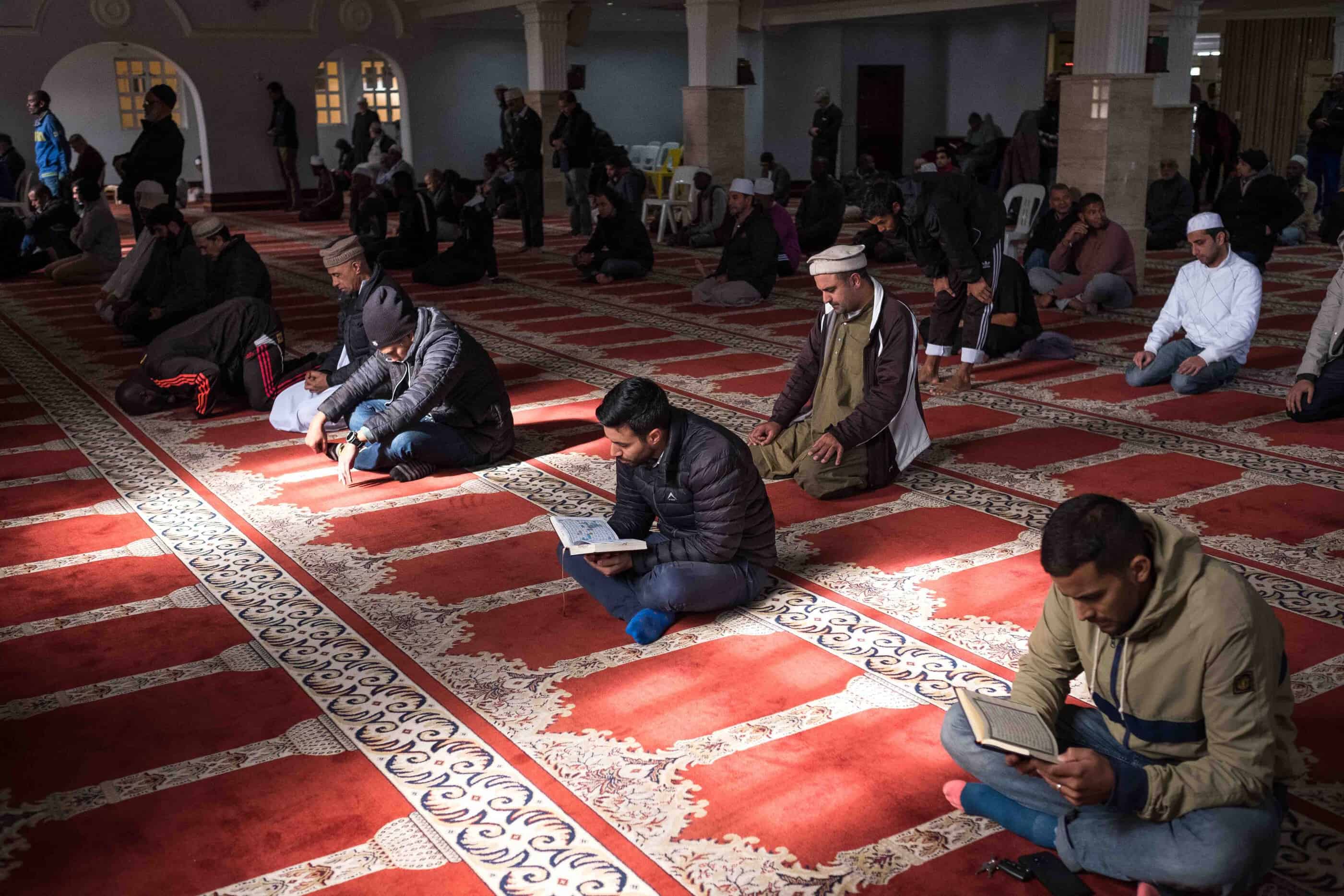 20 May 2019: Men reading the Quran and praying at the historic mosque in District Six.