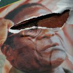 21 March 2008: A torn poster of former Zimbabwean president Robert Mugabe, who despite originally wanting to revert Africa ‘to what it was before the imperialists divided it’ didn’t demonstrate the true meaning of Ubuntu during his long tenure. (Photograph by John Moore/Getty Images)