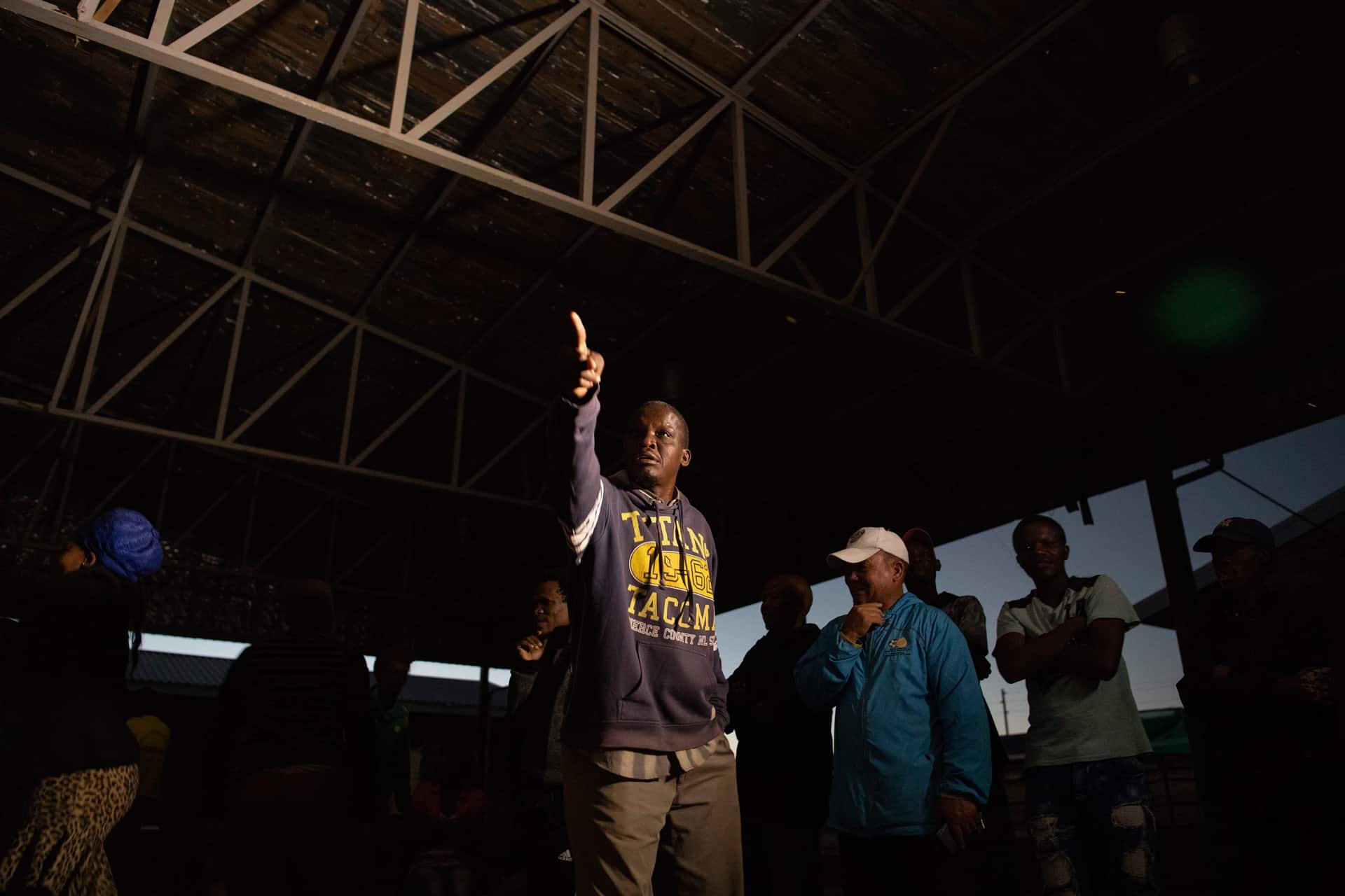 25 April 2019: Local resident Rawe Kakawu reacts in the moment to a statement from the ANC representative in the debate being aired live on X-K Fm.