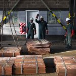 6 July 2016: Workers moving sheets of copper in a warehouse in Mufulira, Zambia. Anglo-Swiss trading and mining firm Glencore owns 73.1% of Zambian-registered Mopani Copper Mines. (Photograph by Per-Anders Pettersson/Getty Images)