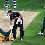 24 March 2015: Grant Elliott of New Zealand helps a gutted Dale Steyn of South Africa up after winning the Cricket World Cup 2015 semifinal against the Proteas at Eden Park in Auckland, New Zealand. (Photograph by Hannah Peters/Getty Images)