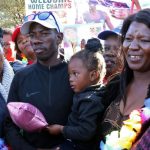 12 June 2019: Comrades Marathon winner Edward Mothibi with wife Esther and daughter Reobametse being welcomed home to Magogoe in Mahikeng, North West. (Photograph by Gallo Images/Sowetan/Tiro Ramatlhatse)