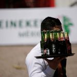 27 February 2018: A waiter carries bottles of beer during the official opening of the new Heineken brewery in Meoqui in Chihuahua state, Mexico. (Photograph by Reuters/Jose Luis Gonzalez)