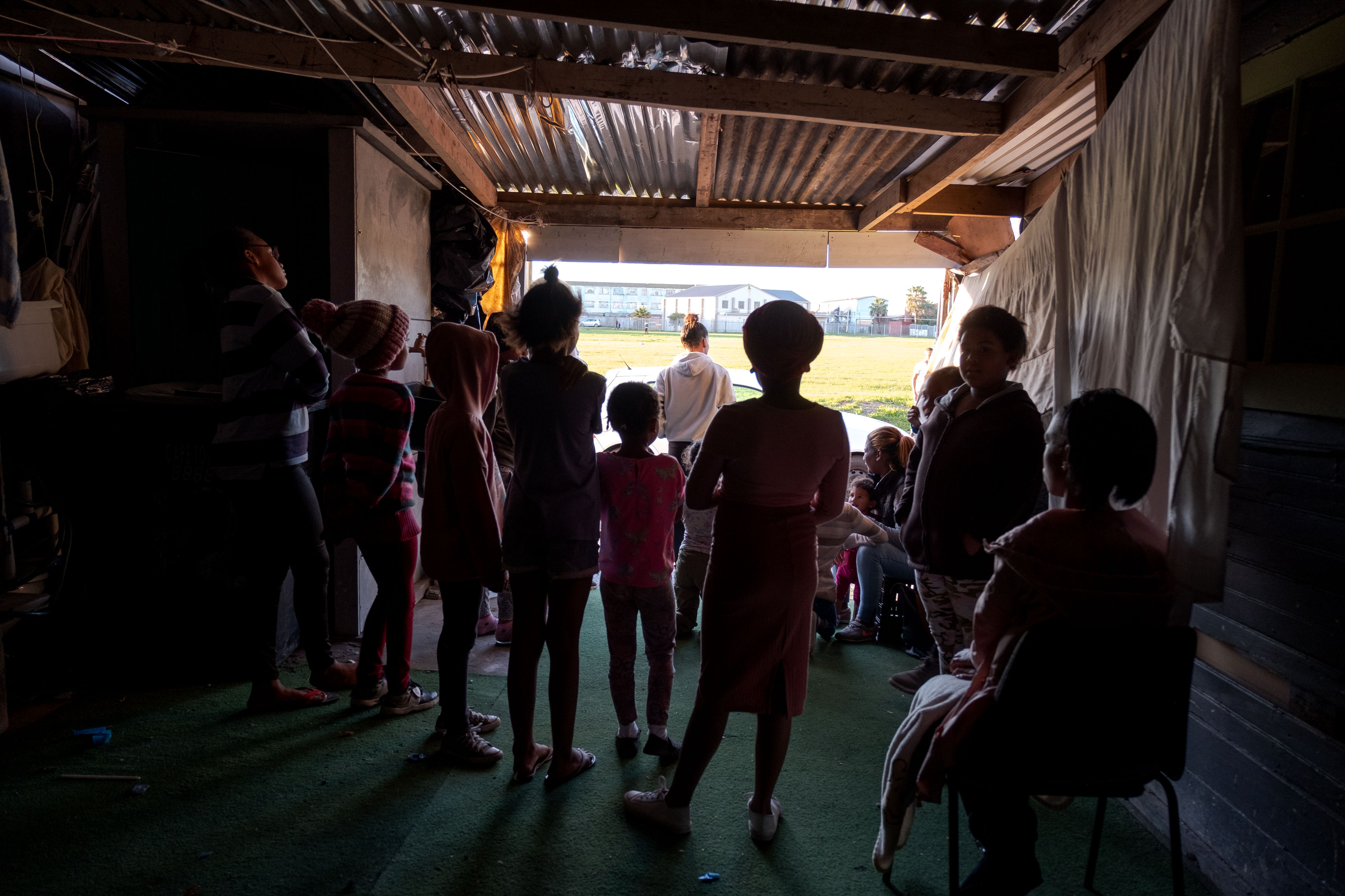 9 July 2019: Members of the Lavender Hill Netball Club at Mark Nicholson’s premises. Gunshots had rung out 10 minutes earlier, in retaliation for a murder that morning.