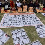 30 August 2017: Relatives hold pictures of missing persons during a protest on International Day of the Disappeared to draw attention to alleged gross human rights violations by Indian troops in Kashmir. (Photograph by Yawar Nazir/Getty Images)