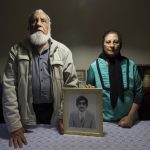 22 March 2018: Ismail Haffejee and Sarah Lall with a portrait of their brother, Hoosen Haffejee, who died in police custody in the cells at Brighton Beach Police Station in Durban, South Africa, in 1977. (Photograph by Rogan Ward/ Mail and Guardian)