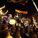 29 January 2014: Libyan football fans celebrate in Martyrs' Square after their national team defeated Zimbabwe in the African Nations Championship semi-final football match in Tripoli, Libya. (Photo by Hazem Turkia/Anadolu Agency/Getty Images)