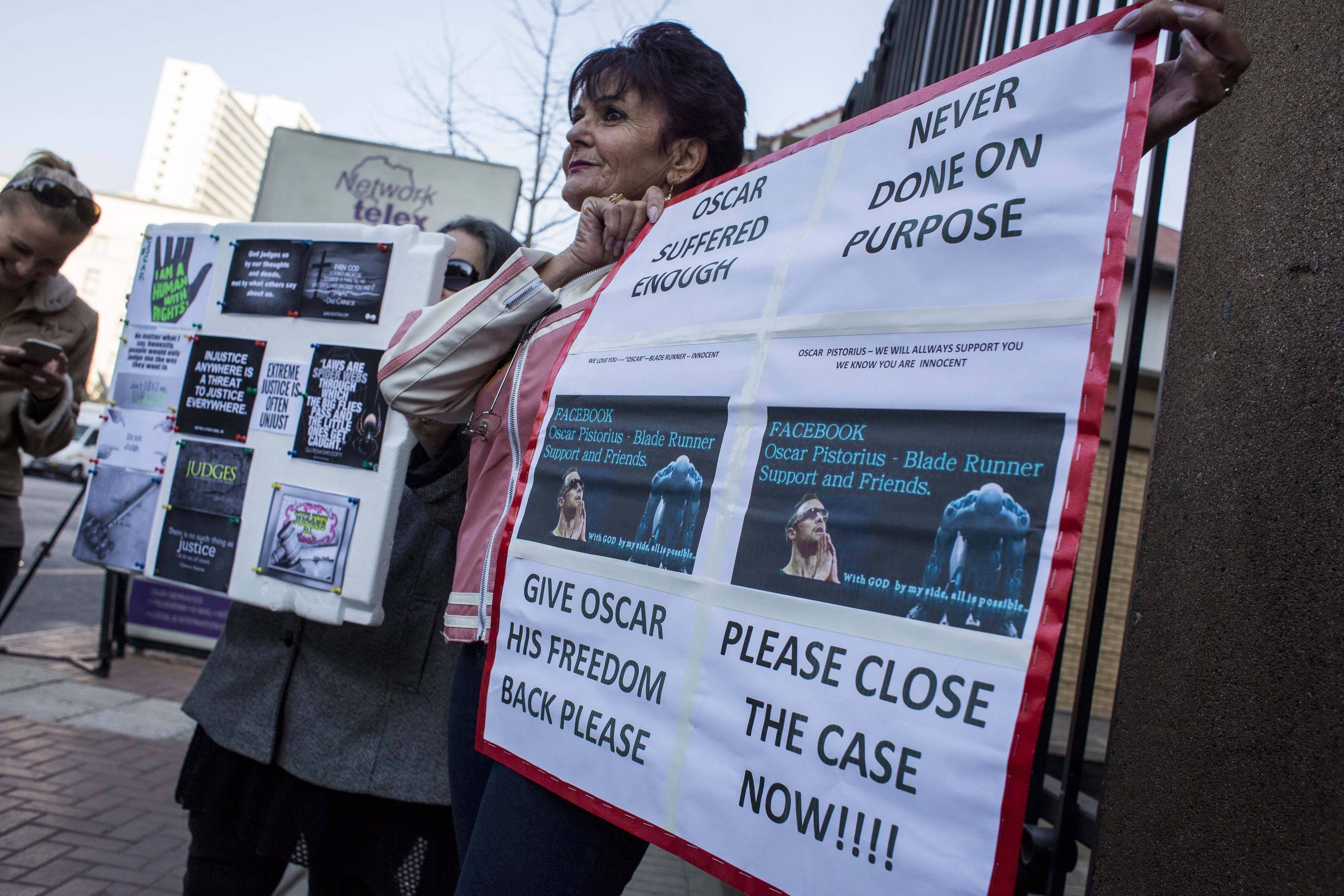 6 July 2016: An Oscar Pistorius supporter outside the North Gauteng High Court in Pretoria, seemingly unmoved by the murder of Reeva Steenkamp in 2013, for which Pistorius was sentenced to six years in jail. (Photograph by Charlie Shoemaker/Getty Images)