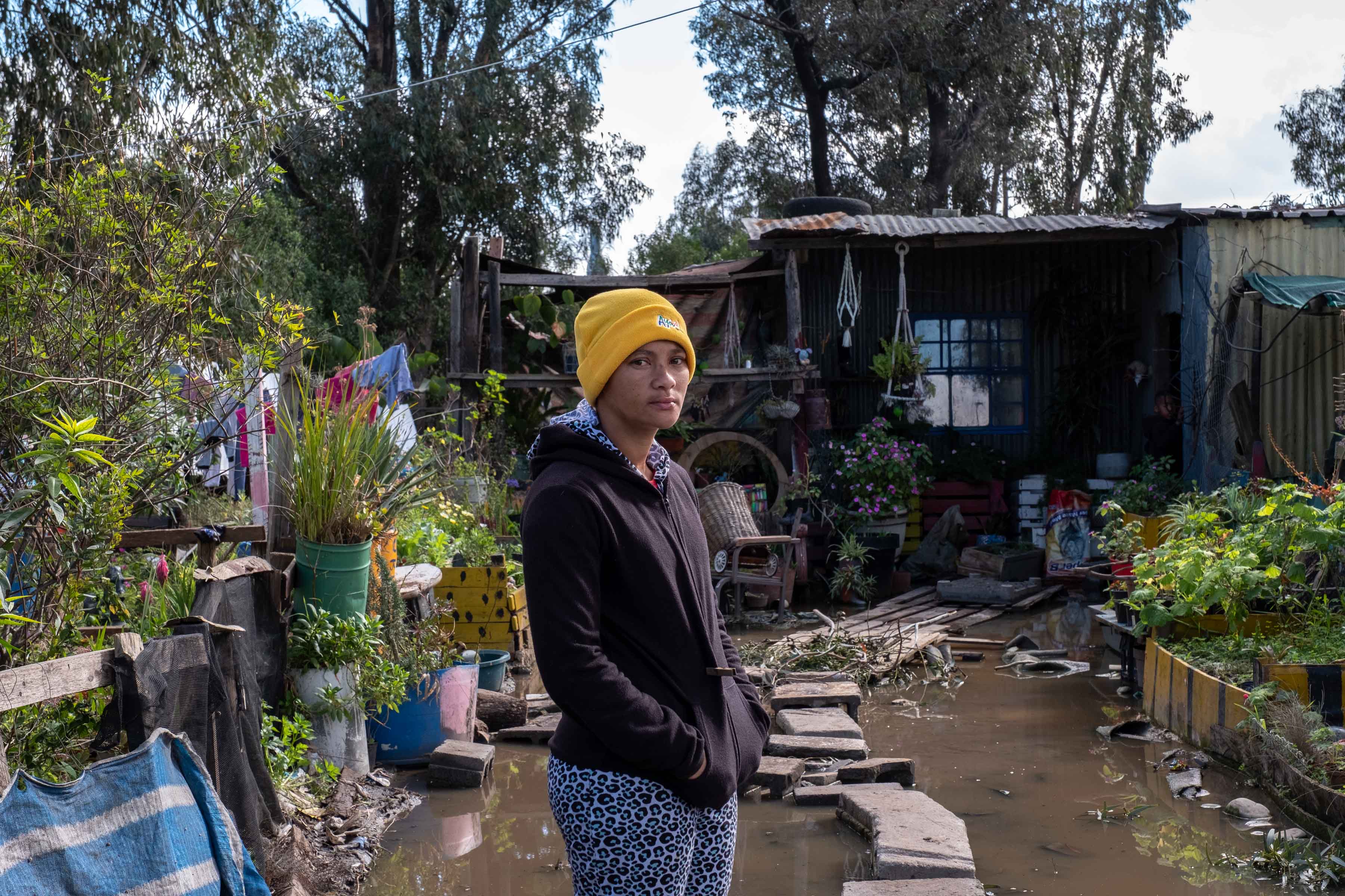 27 August 2019: Roshanda January in front of the shack she and her mother built to live in while they wait for help from disaster services. At the time this photograph was taken, they had been waiting for more than a month.