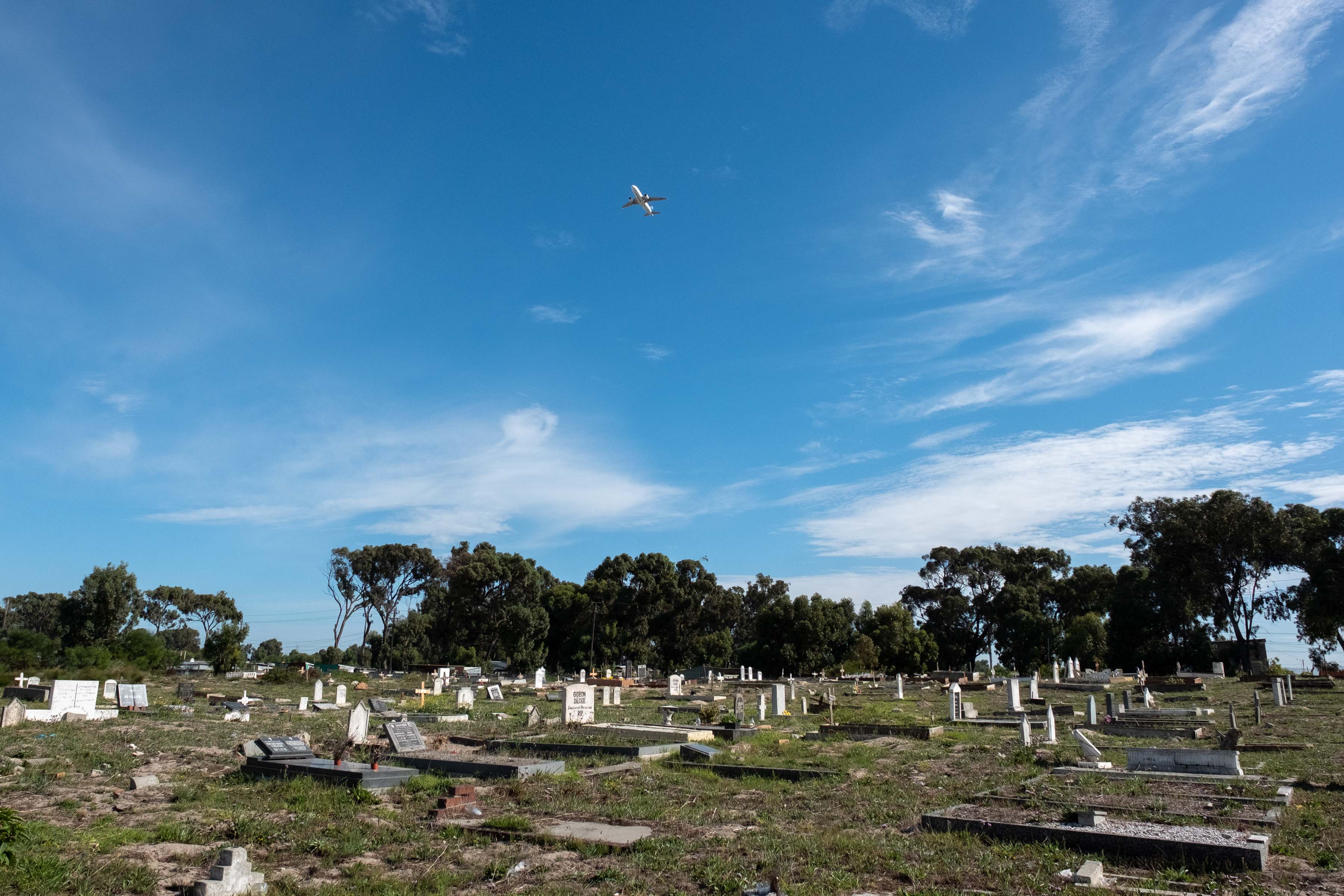 7 April 2019: A plane takes off over the cemetery at the Klipfontein Mission Station. 