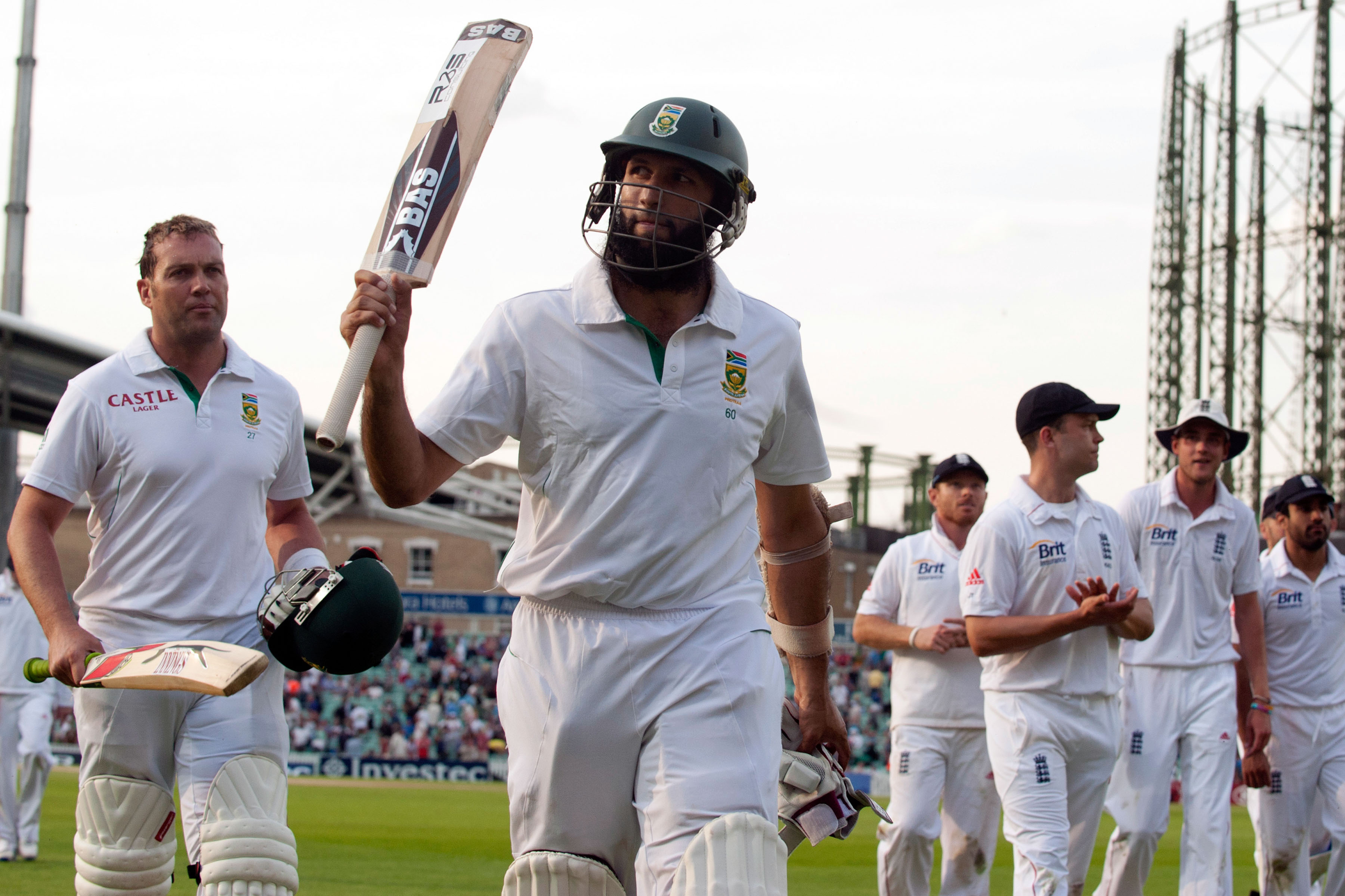 21 July 2012: Jacques Kallis (left) and Hashim Amla (second from left) leaving the field at The Oval in London, England. Amla scored a triple Test century during the first Test of this series against England and is still the only South African to do so. (Photograph by Reuters/Philip Brown) 