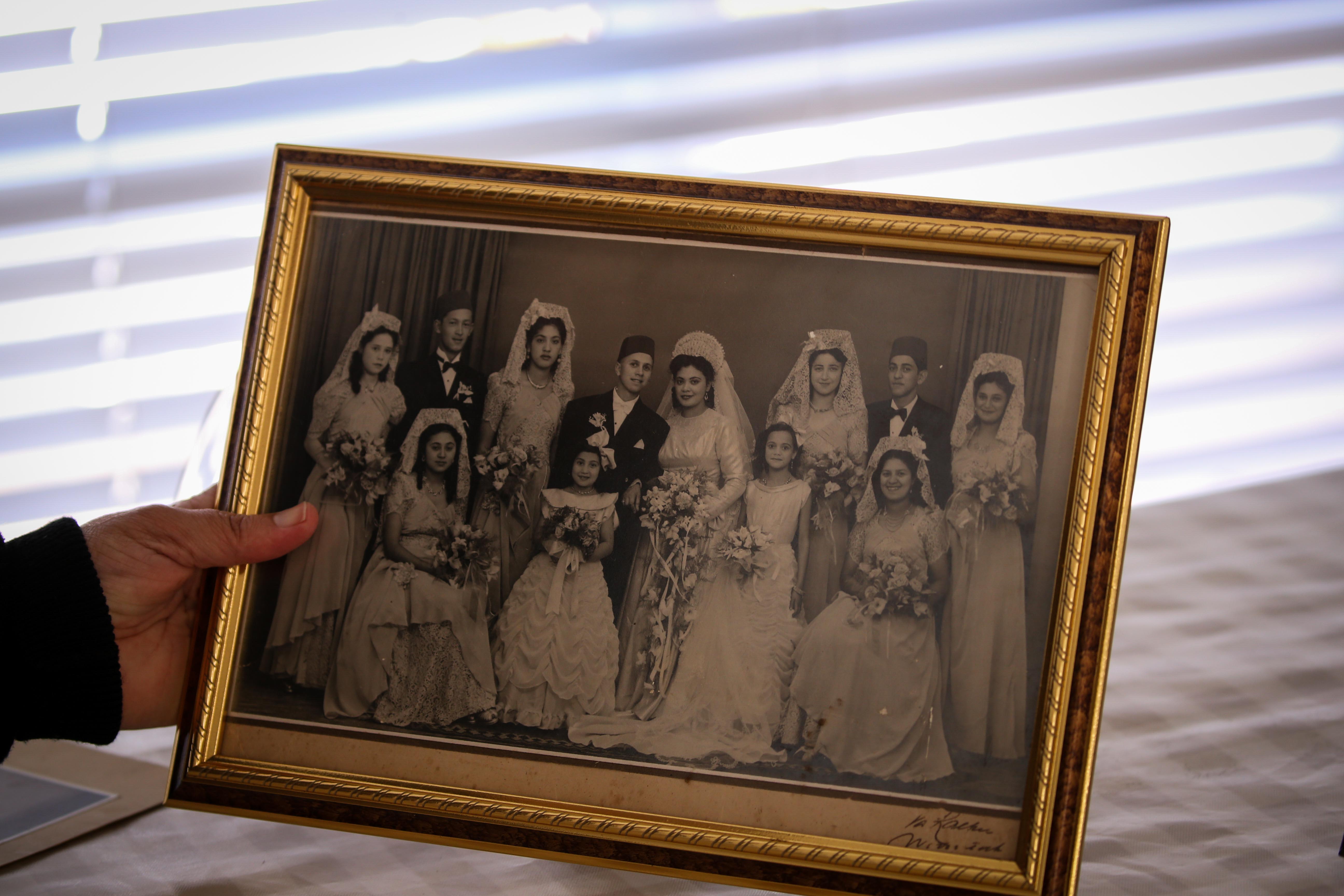 12 September 2019: Fatima Haron-Masoet, daughter of Imam Haron, holds a framed photo of her parents’ wedding at the family home in Athlone, Cape Town.