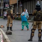 17 August 2019: Indian government forces stop a Kashmiri woman on her way to a hospital amid curfew-like restrictions in Srinagar. Critical medications are running out amid limited access to ambulance services and healthcare facilities in the region. (Photograph by Yawar Nazir/ Getty Images)