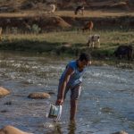 23 August 2019: Local residents such as Simphiwe Ntuli of kwaXimba near Cato Ridge still use the Dusi River to wash clothes despite it being contaminated by cooking oil and caustic soda after an accident at a factory upstream.