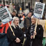 1 May 2019: Protesters holding placards demanding that the system be changed to address the climate emergency during a protest organised by trade union groups in Parliament Square in London, England. (Photograph by John Keeble/Getty Images)