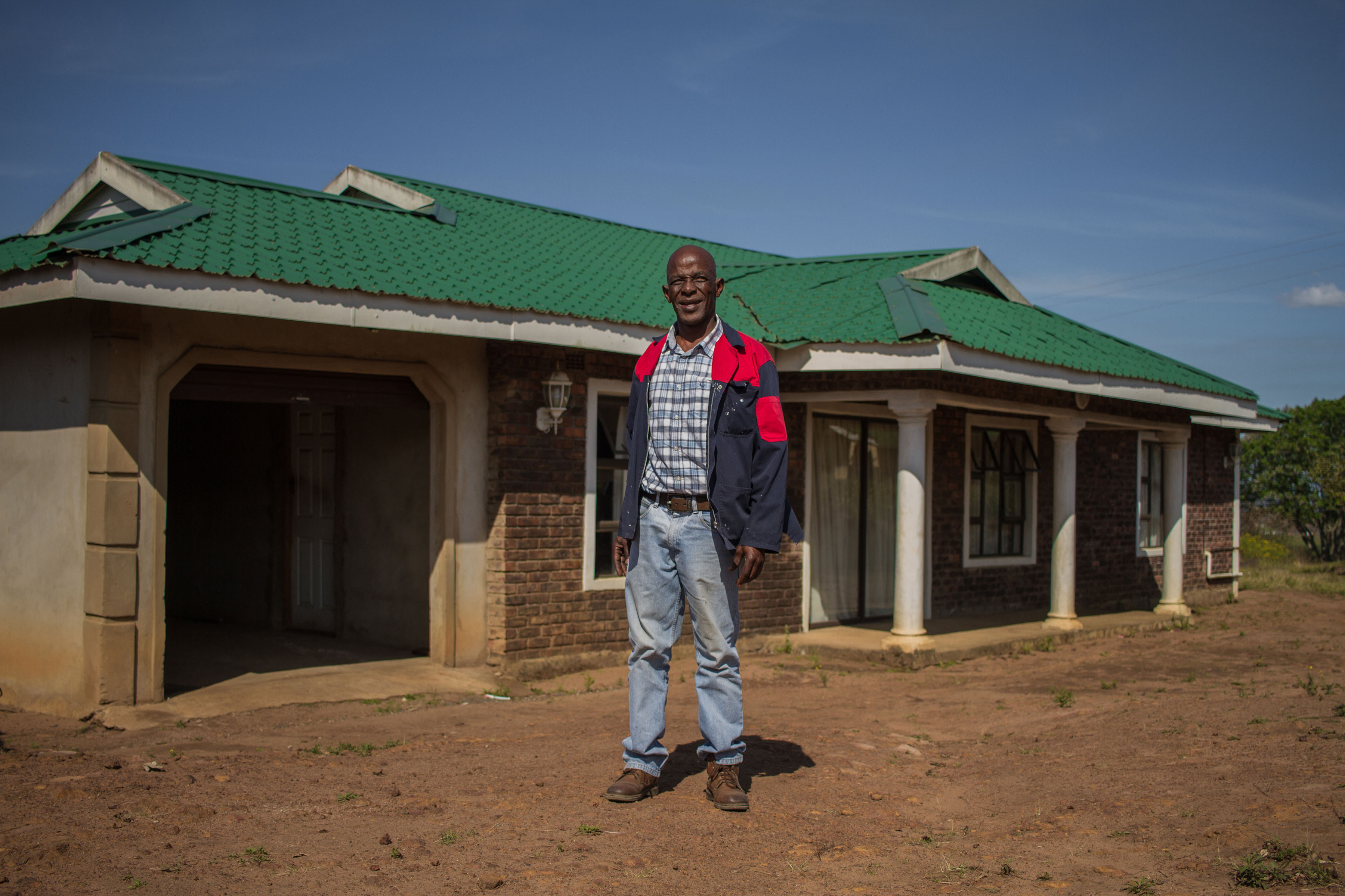 2 October 2019: Zakhele Nkwankwa outside the house he built on land for which he had permission to occupy rights, that the Ingonyama Trust then leased to him. 