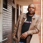 14 September 2019: Vuyolwethu Sibulali outside his room in Block R, where he stays after allegedly facing death threats and police intimidation for speaking out against violence at Glebelands Hostel in Durban. (Photograph by Nomfundo Xolo)