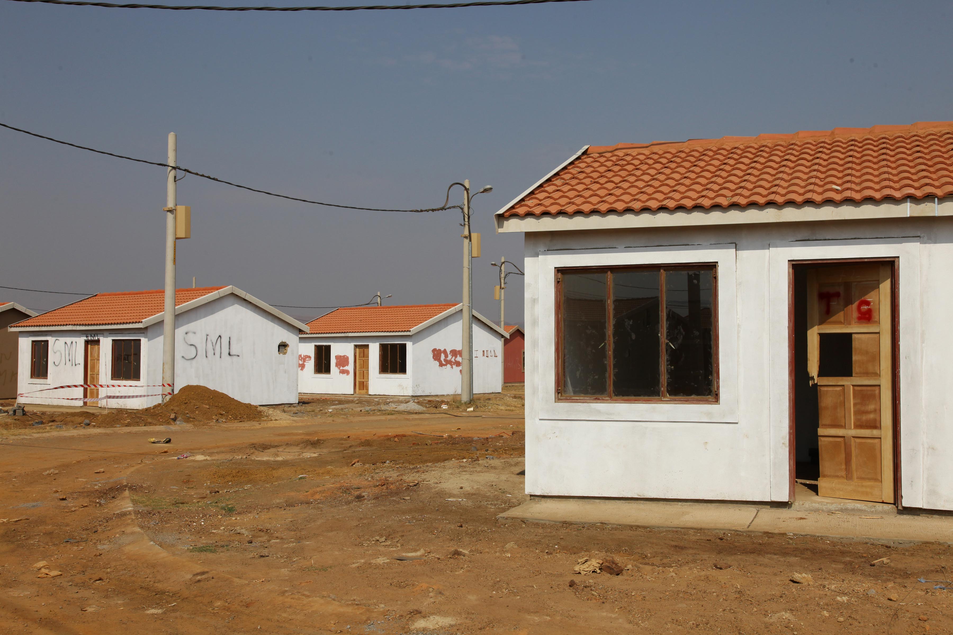 08 August 2019: Damaged doors and windows on houses built for MK veterans at Palm Ridge.