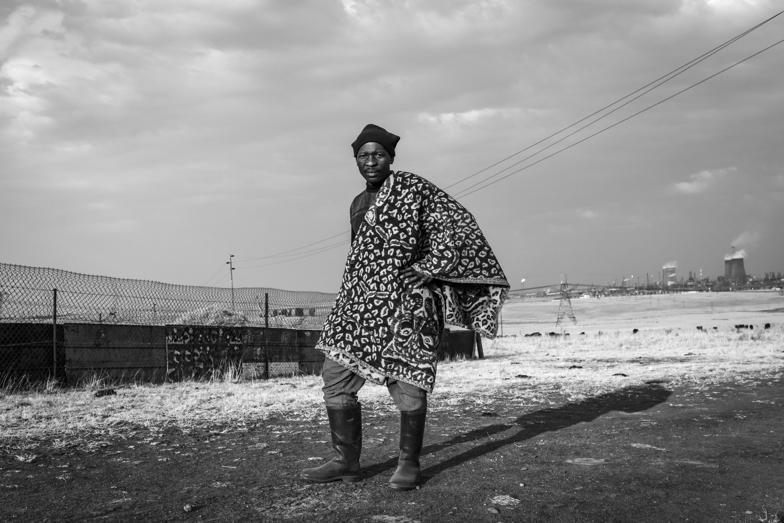 Tumisang Mafa keeps livestock on a patch of land between Secunda and eMbalenhle, near the Sasol Synfuels Plant. ‘I wake up from fever and coughing when I am sleeping,’ he says. eMbalenhle, Mpumalanga.