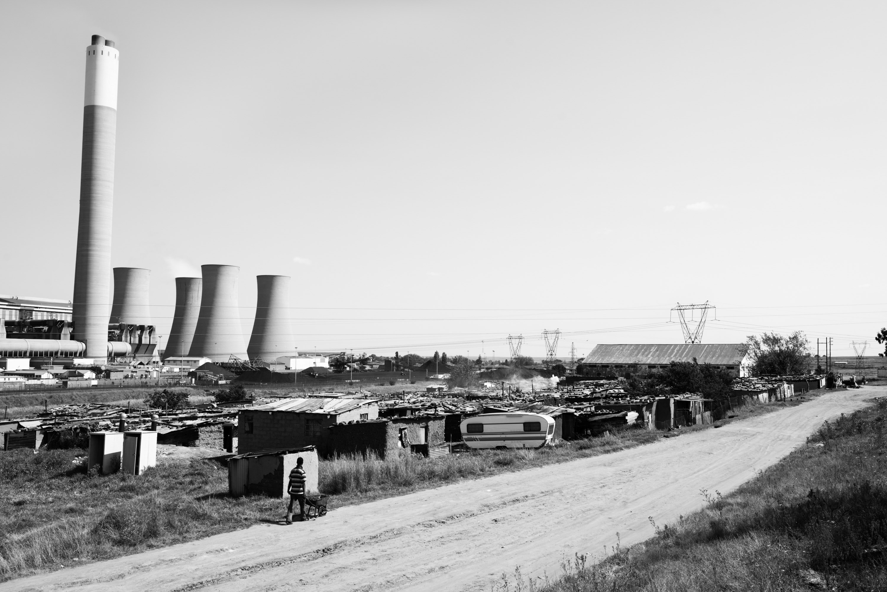 Big House, a settlement next to Komati Power Station. Despite living just a few metres from a power station, the residents of Big House have never had formal access to electricity. Komati, Mpumalanga.