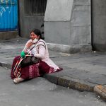 13 November 2019: An indigenous woman reacts during clashes between supporters of former Bolivian President Evo Morales and members of the security forces in La Paz, Bolivia. (Photograph by Reuters/Henry Romero)