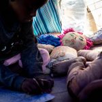 6 November 2019: Seven-year-old Shagayo Kolanda with a sibling in their mother Beatrice Faida's tent at the makeshift refugee camp in Tshwane. Born in the Democratic Republic of the Congo but without DRC papers, Shagayo has not had any schooling in South Africa.