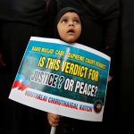 21 November 2019: A Muslim girl holding a placard looks on during a protest to condemn the Supreme Court of India's judgment on the disputed religious site in Ayodhya, Chennai. (Photograph by P Ravikumar/Reuters)