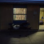 29 October 2019: A miner resting outside the Kroondal Hostel. Workers have been waiting for pension payouts for more than 10 years at a platinum mine in the North West.