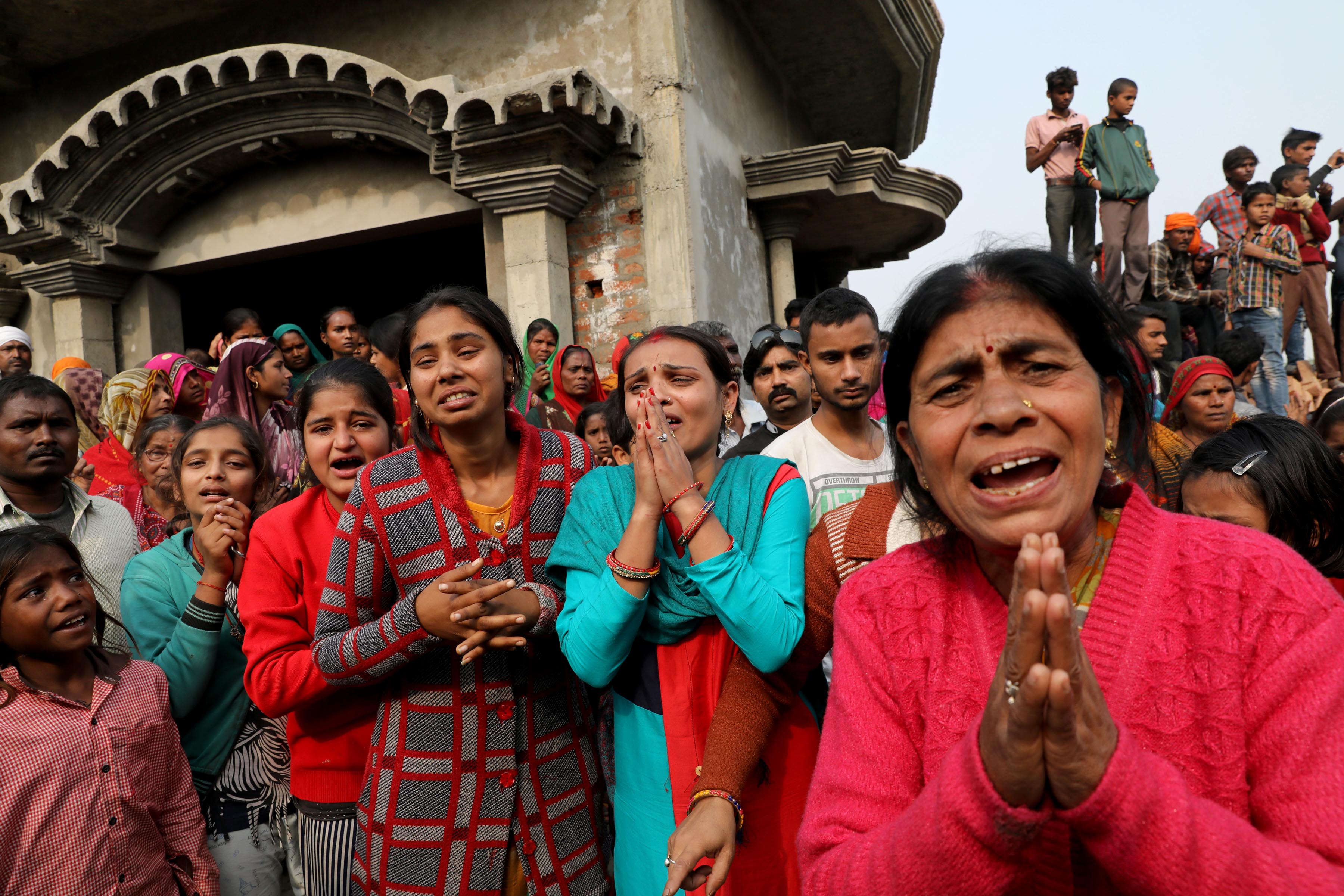 7 December 2019: Relatives of the accused demanding an investigation into the rape of a woman who died after a group of men, including her alleged rapists, set her alight in Unnao in Uttar Pradesh. (Photograph by Reuters/Anushree Fadnavis)