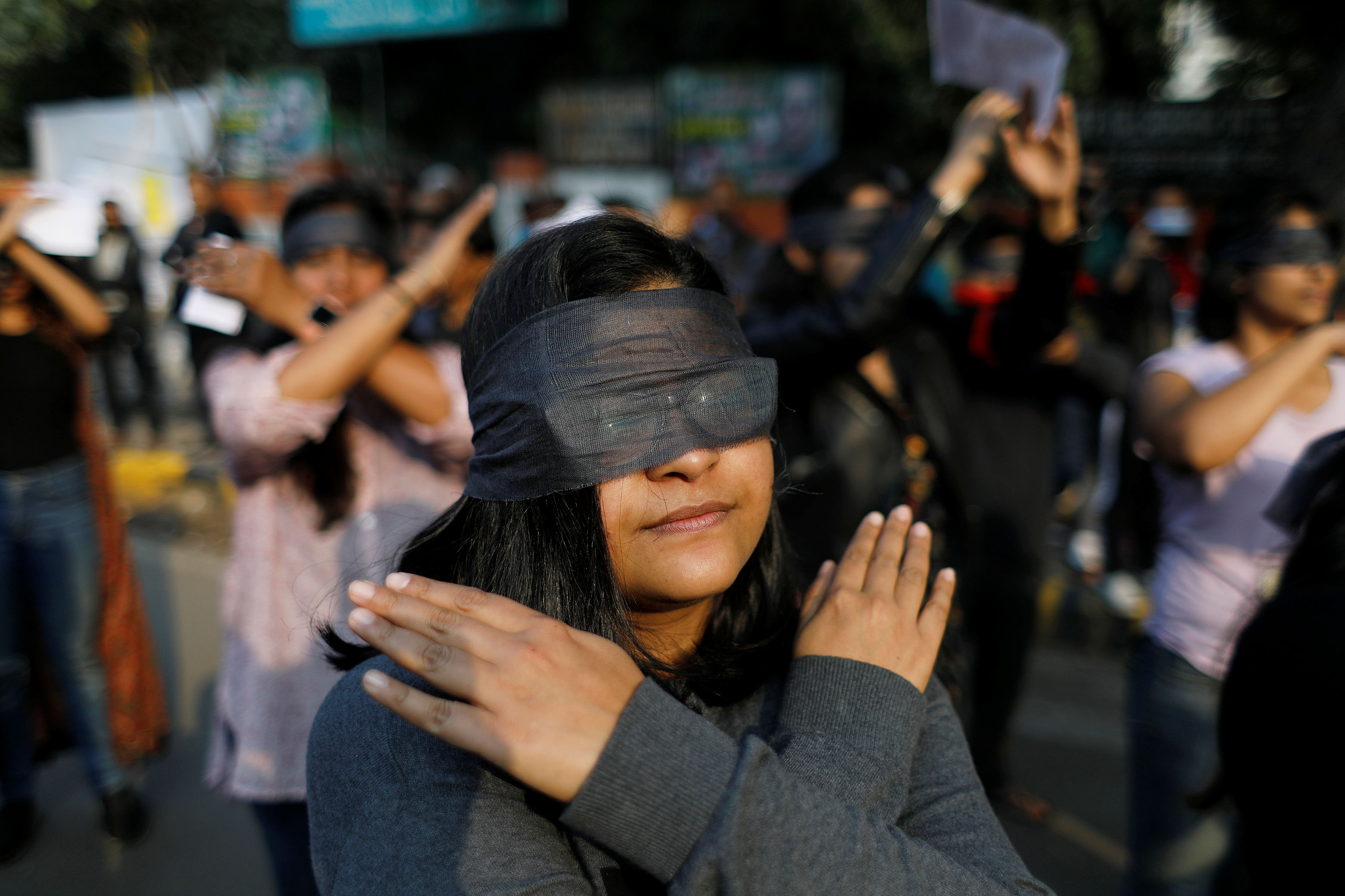 7 December 2019: Protesters wearing blindfolds during a march in New Delhi in solidarity with rape victims and to oppose violence against women in India. (Photograph by Reuters/Adnan Abidi)