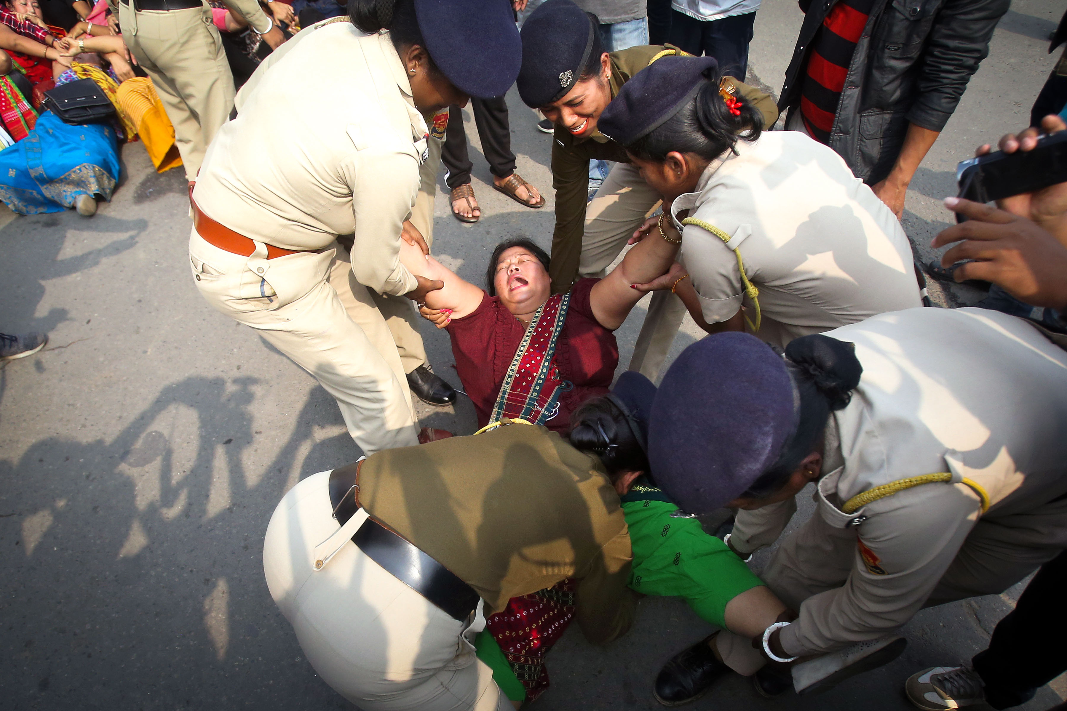 10 December 2019: A demonstrator in Agartala, India, being detained by the police during a protest against the Citizenship Amendment Bill. (Photograph by Reuters/Jayanta Dey)