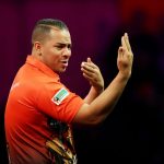 27 December 2013: Devon Petersen during his walk-on for the second round of the 2014 Ladbrokes World Darts Championship at Alexandra Palace in London, England. (Photograph by Action Images/Steven Paston)