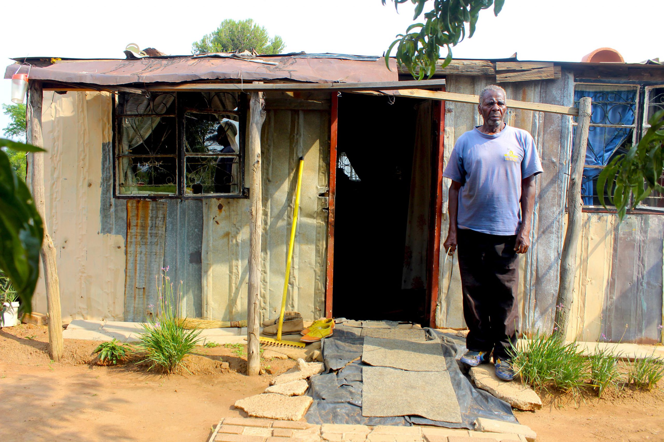 18 March 2019: Mahlomelane Johannes Mthembu outside the shack he has built using his pension money while waiting for the government to build him a house. (Photograph by Funiwe Ngwenya)