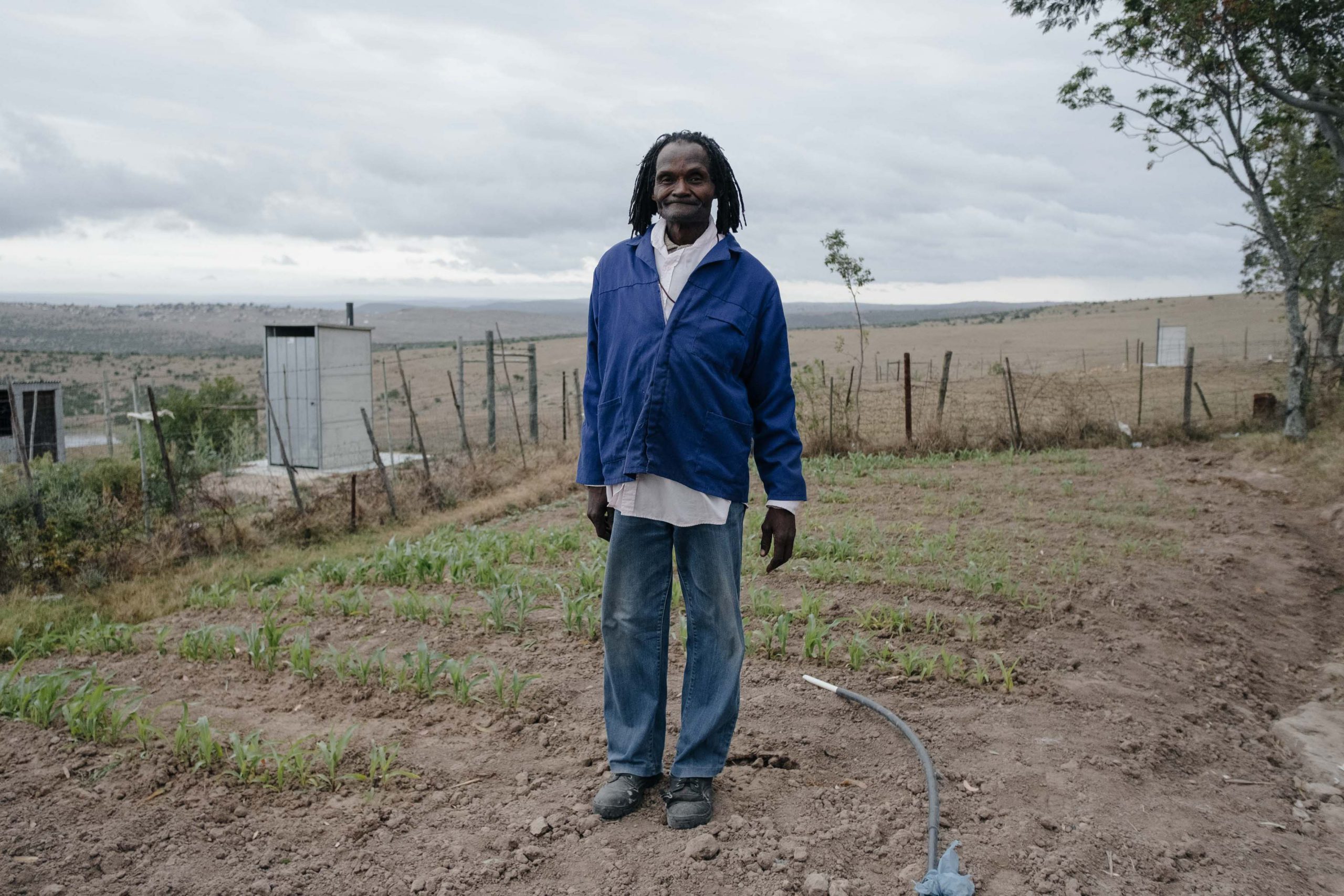 10 November 2019: Subsistence farmer and traditional healer Goodman Bhacela, 70, at his homestead in Ngqwele Village in the Eastern Cape. Unpredictable and insufficient rainfall has forced him to rely on municipal tap water to save his crop. 